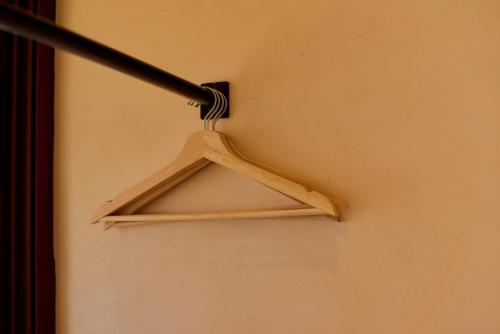 a wooden hanger hanging on a wall at Casa Cambria in Puerto Escondido