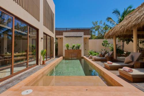 an image of a villa with a swimming pool at Casa Cambria in Puerto Escondido