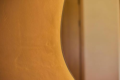 a mirror on the side of a door at Casa Cambria in Puerto Escondido