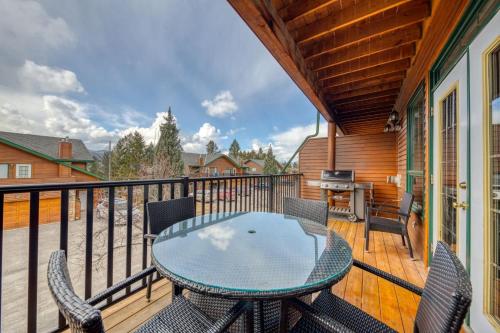 a patio with a table and chairs on a balcony at Marble Canyon in Fairmont Hot Springs