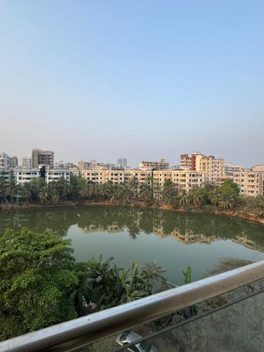 a view of a river with buildings in the background at Pgr homes in Dhaka