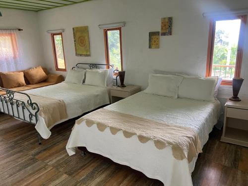 Postel nebo postele na pokoji v ubytování Montecanto