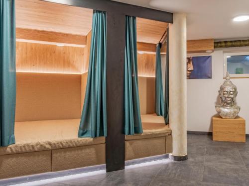 a room with two bunk beds with a statue at Deluxe Zirberl Top 6 in Weisspriach