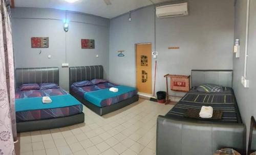 Postel nebo postele na pokoji v ubytování Perhentian Sealife Inn