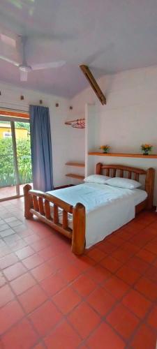 a bedroom with two beds in a room at Casa Campestre in Yopal