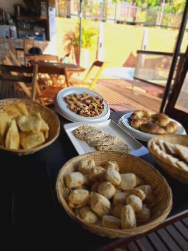 a table with several plates of food on it at Terra Iguazú Cabañas in Puerto Iguazú