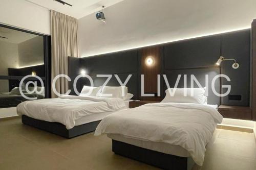 a bedroom with two beds with a large sign on the wall at Mossaz in Petaling Jaya