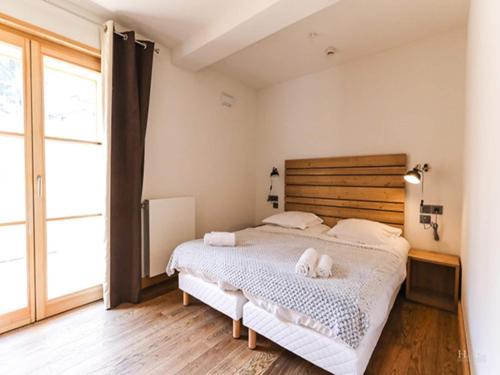 Ένα ή περισσότερα κρεβάτια σε δωμάτιο στο Chalet in Combloux with Mont-Blanc Views