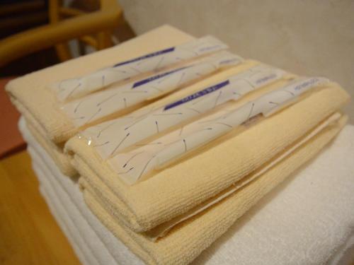 two packages of toilet paper sitting on top of a table at Pension Avenue in Yamanakako
