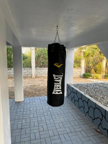 a black bag hanging from the ceiling of a room at U Cube Staycation in Manaoag