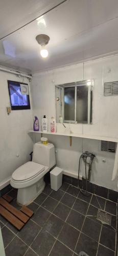 a bathroom with a toilet and a sink and a tub at JTN House for daily rent in Seoul Oktabang in Seoul