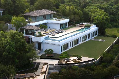 an aerial view of a house with a swimming pool at FU VALLEY Hotel in Liyang