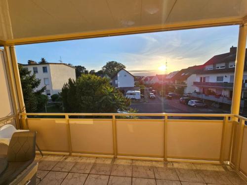a room with a large window with a view of a street at 3 Room Apartmend by Frankfurt in Bad Vilbel