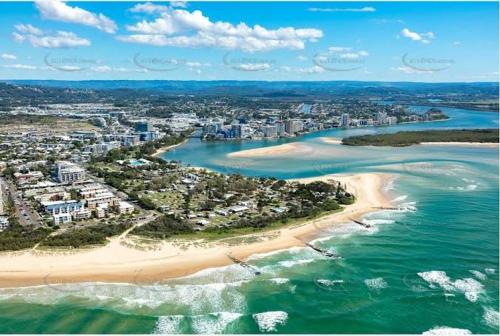 an aerial view of a beach and the ocean at HEART OF Cotton Tree, Maroochydore BEACH & RIVER in Maroochydore