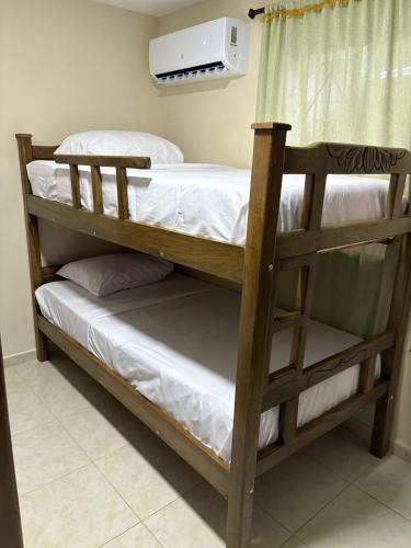 a couple of bunk beds in a room at Apartamentos KARS in Ríohacha