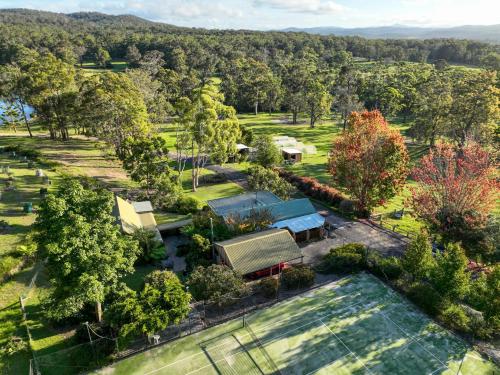 an aerial view of a house with trees and a pool at Kangarutha Cottage - Escape to Nature just minutes to Tathra in Kianinny