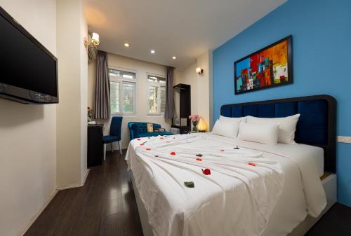 Giường trong phòng chung tại Mai Charming Hotel and Spa