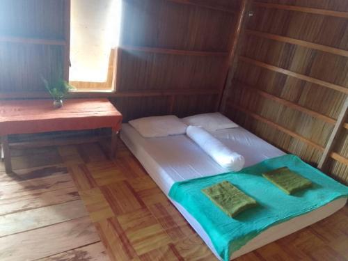 Postel nebo postele na pokoji v ubytování Sea Fans Homestay