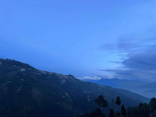 a view of a mountain with a blue sky at The Good Time homestay in Jālāpahār