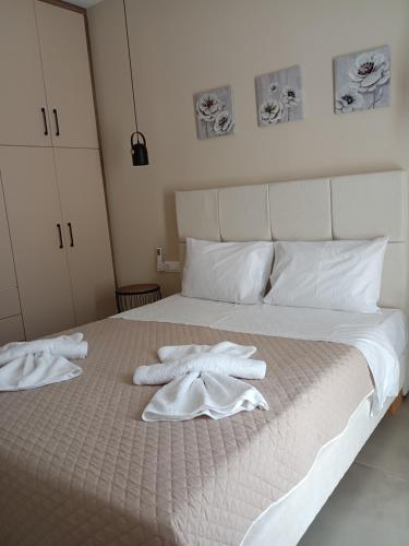 a bedroom with two towels on a bed at SeaEsta Vasiliki 4 in Vasiliki