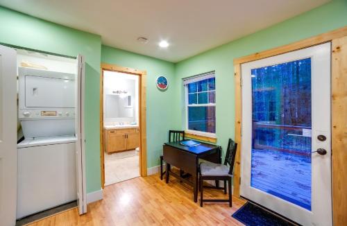 a room with green walls and a desk and a window at Glacier Springs Cabin 12 - Pet Friendly, WIFI, AC, Sleeps 4 in Deming