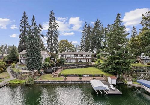an aerial view of a house with a pond at Lakefront near Seattle, Mt Rainier & Ocean Shores in Spanaway