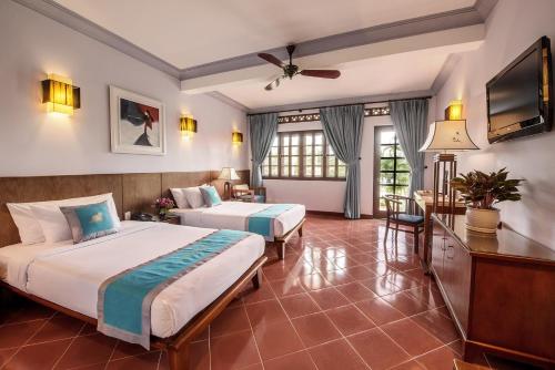 Postel nebo postele na pokoji v ubytování Phu Hai Beach Resort & Spa Phan Thiet
