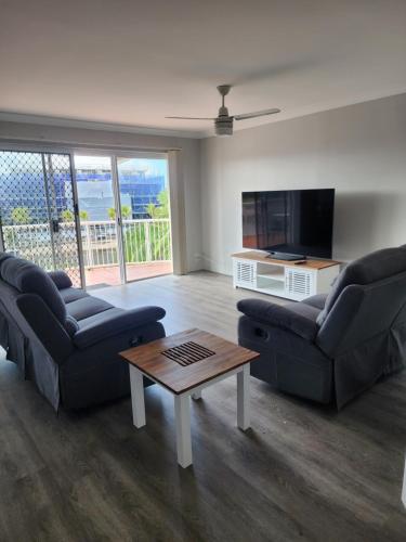 a living room with two couches and a coffee table at Bayview Anchorage in Gold Coast