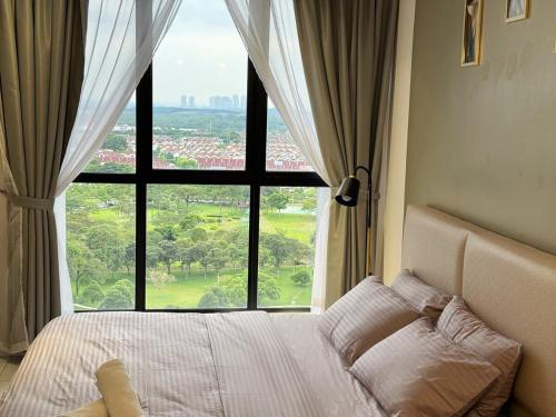 a bed in a bedroom with a large window at 1810 SkyTree bukitindah Aeon Legoland 2-3pax in Johor Bahru