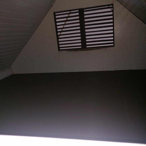an empty room with a window in a building at Rangiroa Natura Lodge in Avatoru
