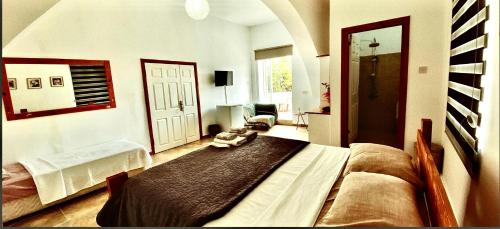 a bedroom with a large bed in a room at Hera palace boutique otel in Yialousa