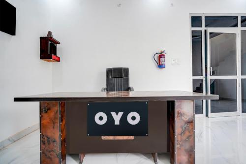 a table with an ovo sign on it at Hotel O Signature hotel in Meerut
