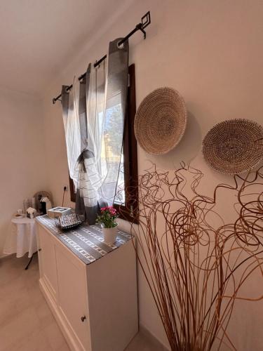 a kitchen with a counter and a window at Vista d'Ogliastra in Gàiro SantʼElena