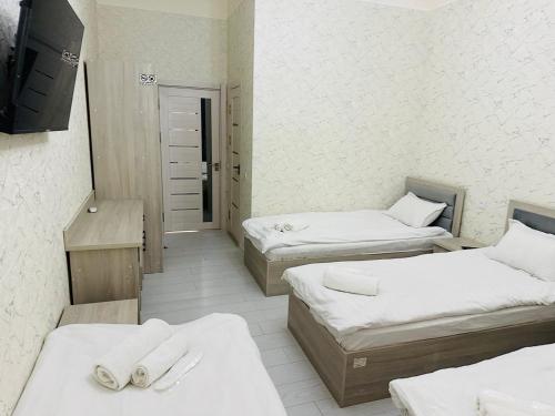 Postel nebo postele na pokoji v ubytování FORTUNA HOSTEL