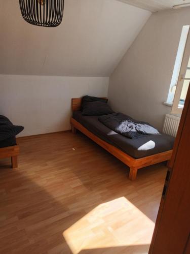 a bedroom with a bed in the corner of a room at Herbrechtingen Eselsburg in Herbrechtingen