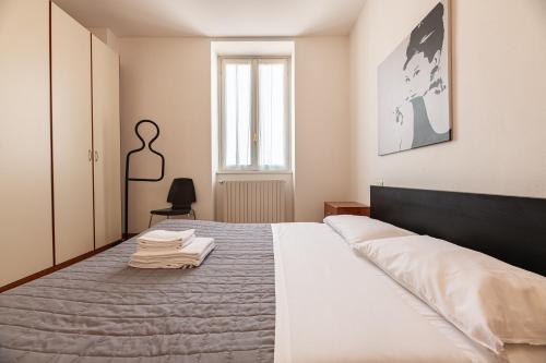 Ένα ή περισσότερα κρεβάτια σε δωμάτιο στο Varenna Lake View Apartments