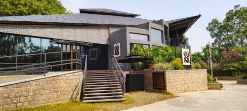 a house with a staircase in front of it at The Golkonda Resort and Spa in Hyderabad