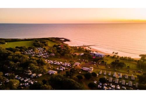 an aerial view of a festival on the beach at Discovery Parks - Bargara in Bargara