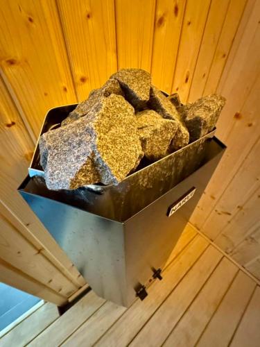 a container of rocks sitting on top of a ceiling at Henry Domki - prywatna sauna i jacuzzi in Żywiec