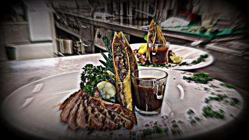 two plates of food on top of a table at Hotel Gasthof Tirolerwirt in Bischofshofen