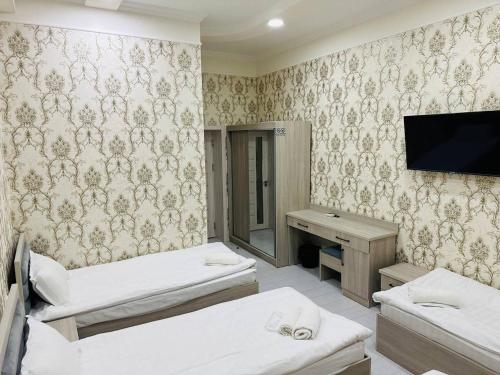 Postel nebo postele na pokoji v ubytování FORTUNA HOSTEL