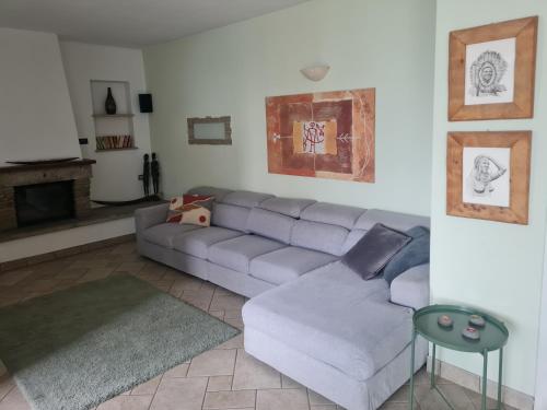 a living room with a couch and a table at GAIA in Lierna