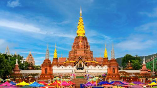 a temple with a bunch of umbrellas in front of it at 西双版纳景洪恩季国际酒店 in Jinghong