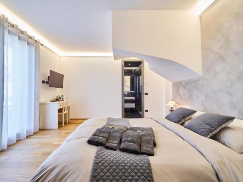 a bedroom with a large bed with pillows on it at Monza Design Villa by GIOs Private Pool in Monza