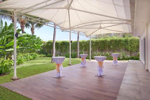 a dance floor under an umbrella at a wedding at Grand Mercure Bali Seminyak in Seminyak