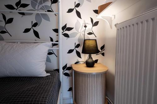 a bedroom with a bed and a lamp on a table at Seaside Astros Getaway - La Maison Etoile in Paralion astros