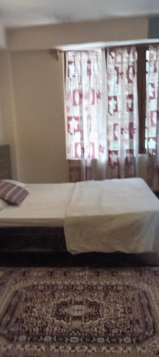 Cama o camas de una habitación en Ronglyang Villa Homestay Near MG Road
