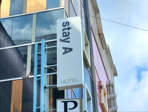 a hotel sign on the side of a building at Stay A Hotel Gwangan in Busan