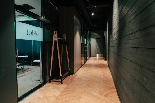 a hallway of a store with a cross on the wall at Original Sokos Hotel Rikala Salo in Salo