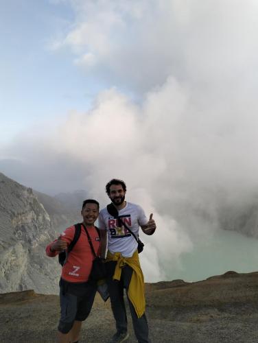 two men standing on top of a mountain at Nio Homestay and Tour in Licin
